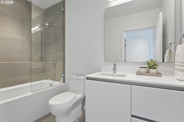 1150 NW Quimby St Unit 608, Portland, OR 97209 - bathroom featuring toilet, vanity, and enclosed tub / shower combo