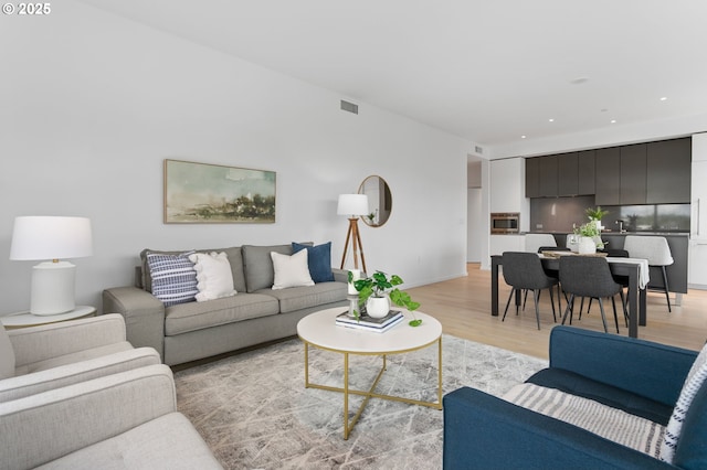 1150 NW Quimby St Unit 608, Portland, OR 97209 - living area with light wood-style flooring and recessed lighting