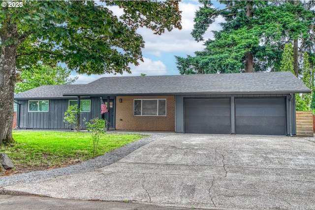 605 SE 104th Ave, Vancouver, WA 98664 - ranch-style home featuring a garage, a front yard, driveway, a shingled roof, and brick siding