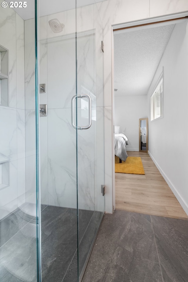 605 SE 104th Ave, Vancouver, WA 98664 - full bathroom featuring a marble finish shower, ensuite bathroom, wood finished floors, and a textured ceiling