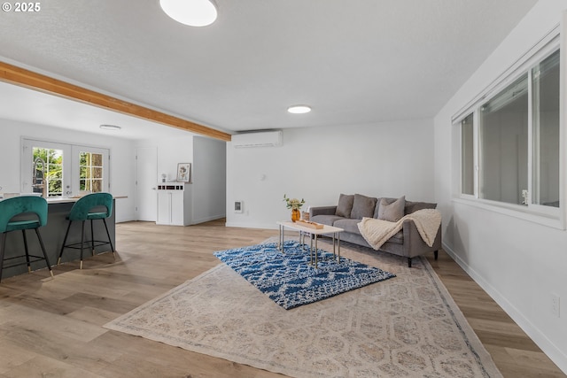 605 SE 104th Ave, Vancouver, WA 98664 - living room featuring light wood-style flooring and an AC wall unit