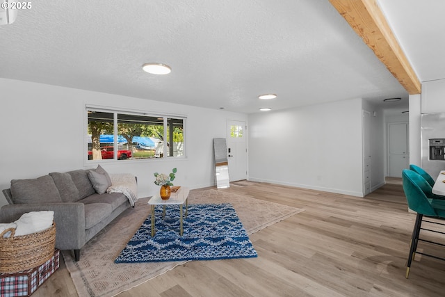 605 SE 104th Ave, Vancouver, WA 98664 - living area featuring wood finished floors and a textured ceiling