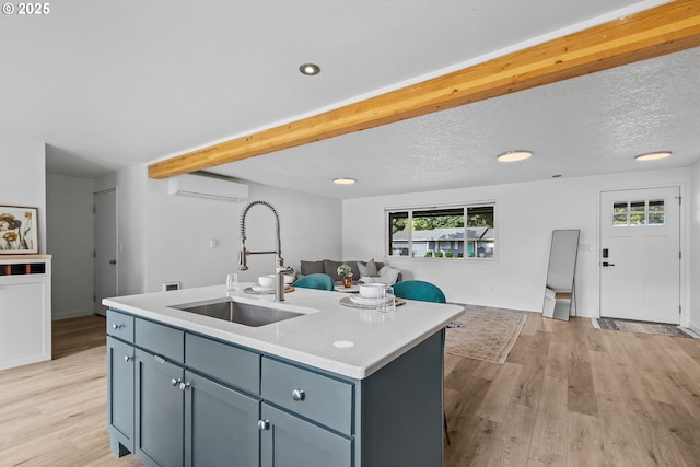 605 SE 104th Ave, Vancouver, WA 98664 - kitchen featuring a wall unit AC, open floor plan, plenty of natural light, light wood-type flooring, and recessed lighting