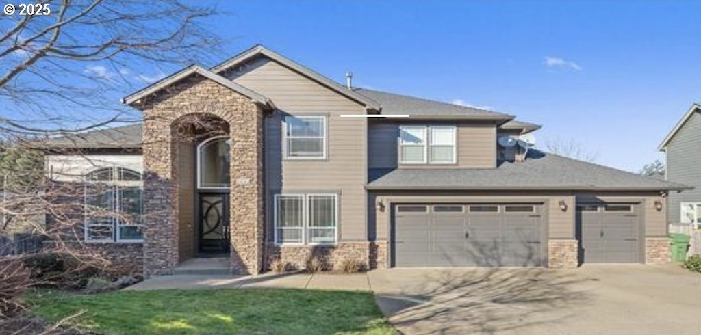 2021 Pikes Pass Ct, Salem, OR 97306 - traditional-style house with stone siding and concrete driveway