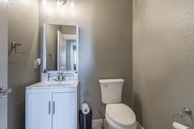 2021 Pikes Pass Ct, Salem, OR 97306 - half bath featuring a textured wall, vanity, and toilet