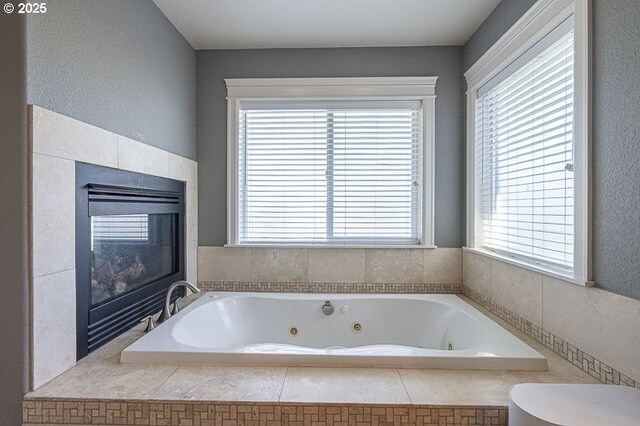 2021 Pikes Pass Ct, Salem, OR 97306 - full bathroom featuring a tub with jets and a fireplace