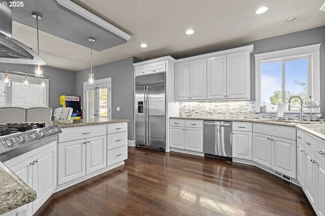 2021 Pikes Pass Ct, Salem, OR 97306 - kitchen with stainless steel appliances, dark wood-style floors, recessed lighting, tasteful backsplash, and white cabinets