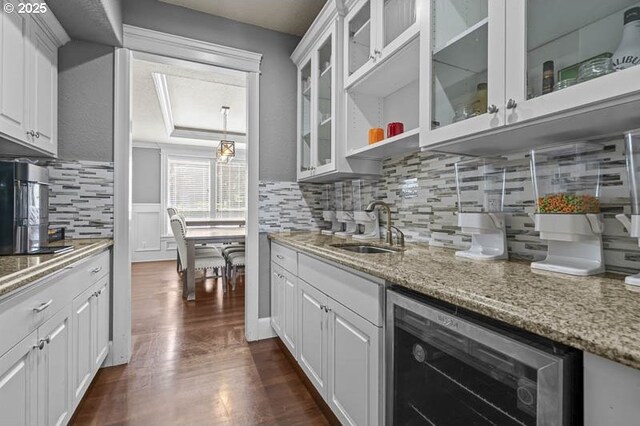 2021 Pikes Pass Ct, Salem, OR 97306 - kitchen with beverage cooler, a sink, white cabinetry, tasteful backsplash, and dark wood-style floors