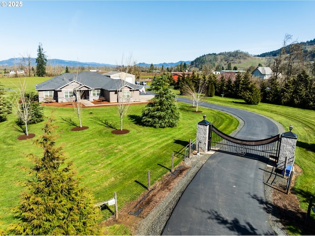 birds eye view of property with a mountain view