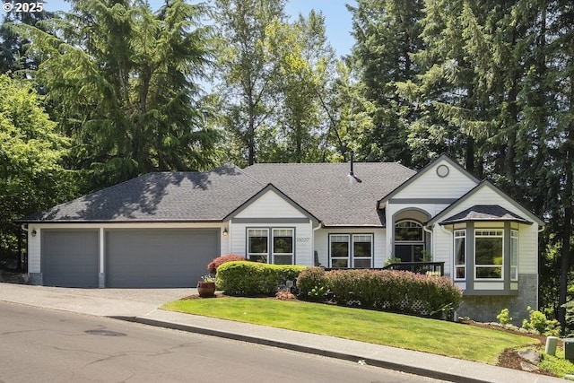 13037 SW Ascension Dr, Portland, OR 97223 - view of front of property with a garage, a front yard, driveway, and a shingled roof
