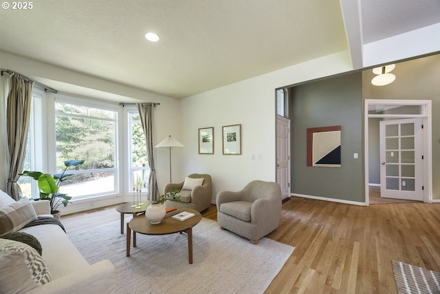 13037 SW Ascension Dr, Portland, OR 97223 - living room featuring healthy amount of natural light, wood finished floors, baseboards, and recessed lighting