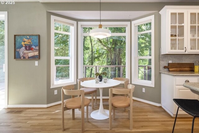 13037 SW Ascension Dr, Portland, OR 97223 - dining room with baseboards, light wood finished floors, and healthy amount of natural light