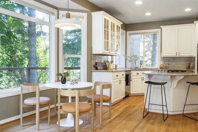 13037 SW Ascension Dr, Portland, OR 97223 - kitchen with tasteful backsplash, white cabinetry, and recessed lighting