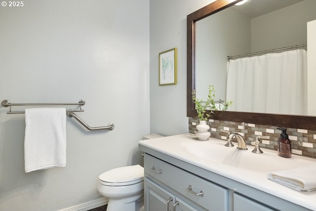 13037 SW Ascension Dr, Portland, OR 97223 - bathroom with vanity, decorative backsplash, toilet, and baseboards