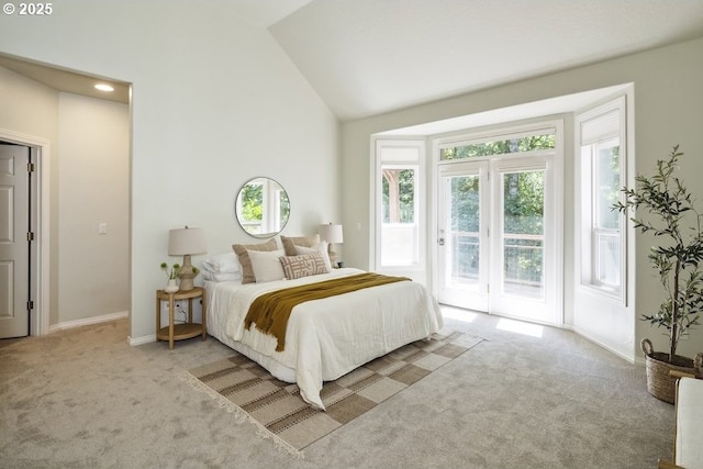 13037 SW Ascension Dr, Portland, OR 97223 - carpeted bedroom featuring access to exterior, baseboards, and high vaulted ceiling