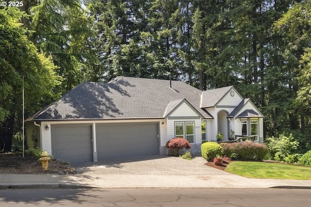 13037 SW Ascension Dr, Portland, OR 97223 - view of front of house featuring a garage, driveway, and a shingled roof