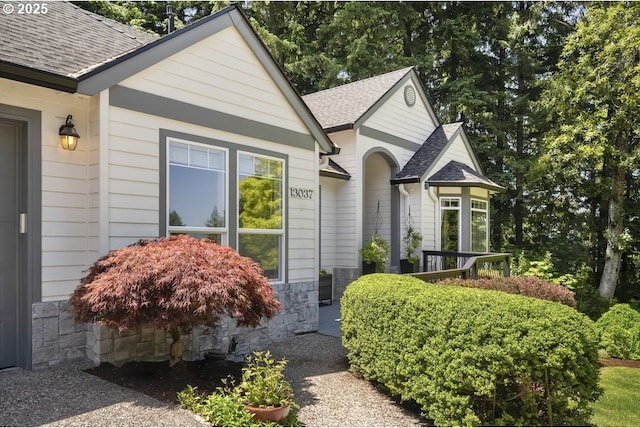 13037 SW Ascension Dr, Portland, OR 97223 - view of front of house featuring roof with shingles and stone siding
