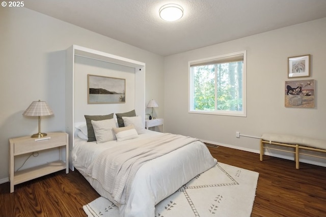 13037 SW Ascension Dr, Portland, OR 97223 - bedroom featuring baseboards and dark wood-style flooring
