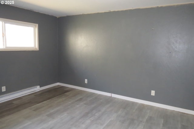 1817 Shamrock Dr, Centralia, WA 98531 - empty room with baseboards, wood finished floors, and a baseboard radiator