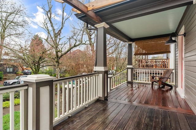 wooden terrace with a porch