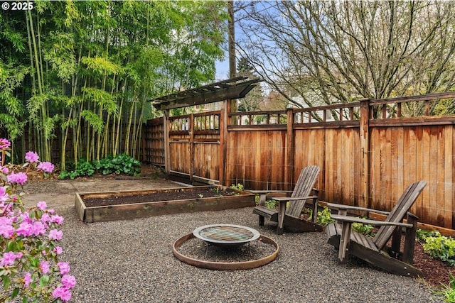 view of yard with a vegetable garden and a fenced backyard