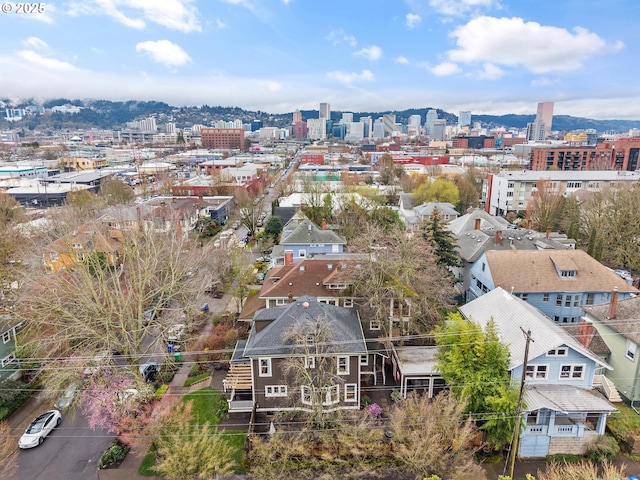 birds eye view of property featuring a city view