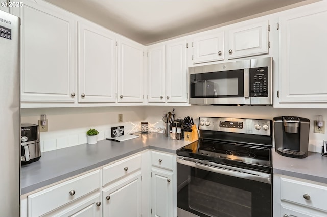 kitchen featuring white cabinetry and stainless steel appliances