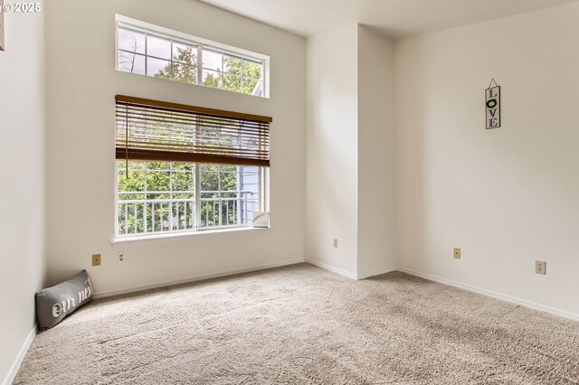 17532 NW Springville Rd Unit D8, Portland, OR 97229 - carpeted empty room with healthy amount of natural light