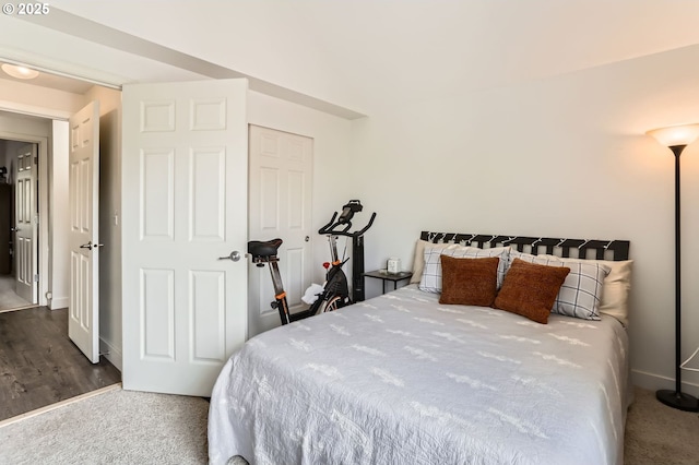 bedroom with baseboards and carpet floors