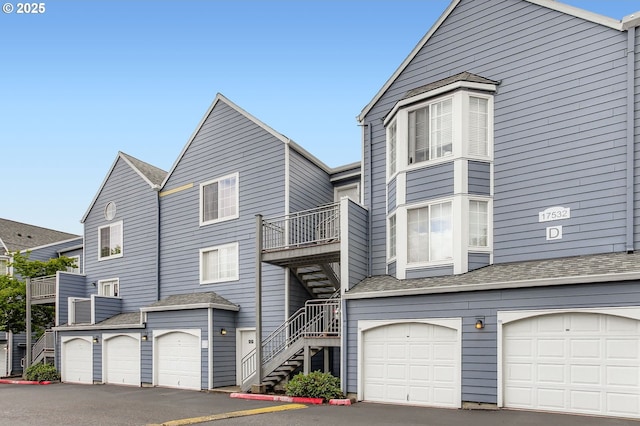 17532 NW Springville Rd Unit D8, Portland, OR 97229 - townhome / multi-family property with an attached garage, stairs, and asphalt driveway