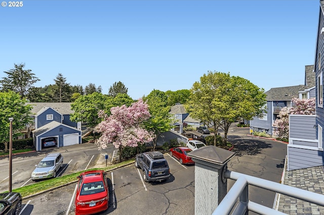 17532 NW Springville Rd Unit D8, Portland, OR 97229 - view of asphalt road featuring curbs, street lights, and sidewalks