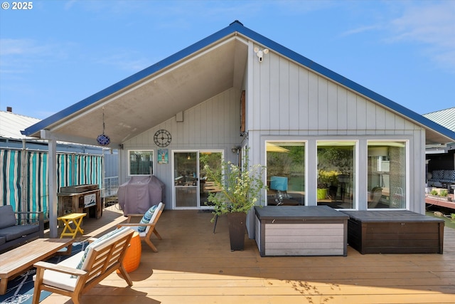 rear view of property with a deck