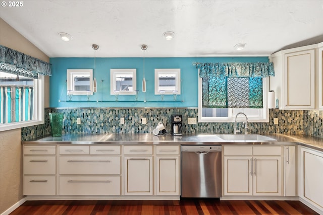 kitchen with stainless steel counters, dishwasher, dark wood-type flooring, a sink, and backsplash