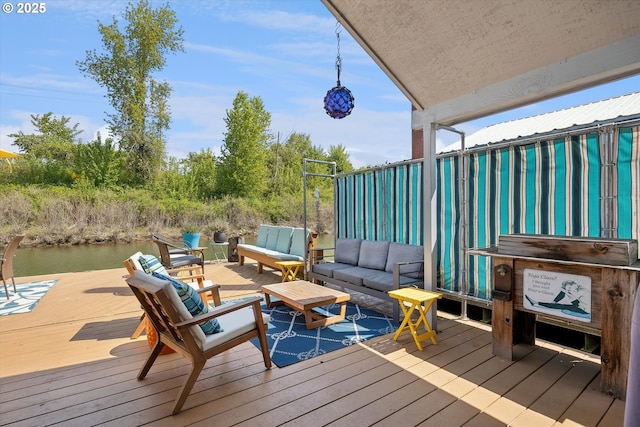 wooden terrace with outdoor lounge area