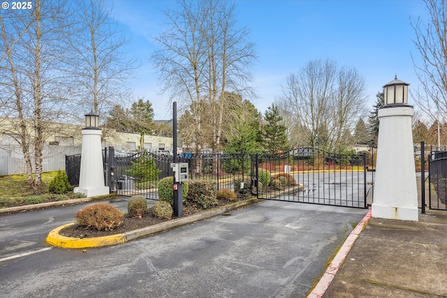 view of gate featuring fence