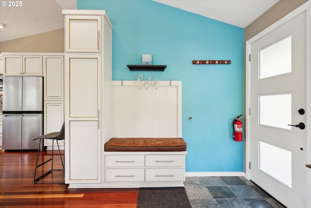 mudroom with plenty of natural light and lofted ceiling