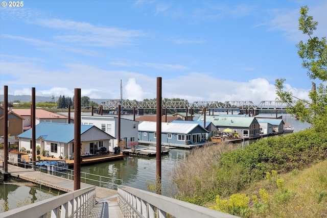 dock area with a water view and a residential view