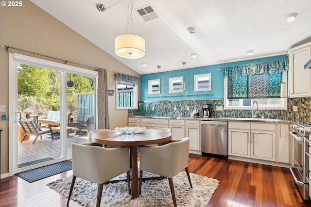 dining room featuring visible vents, lofted ceiling, and dark wood-style floors