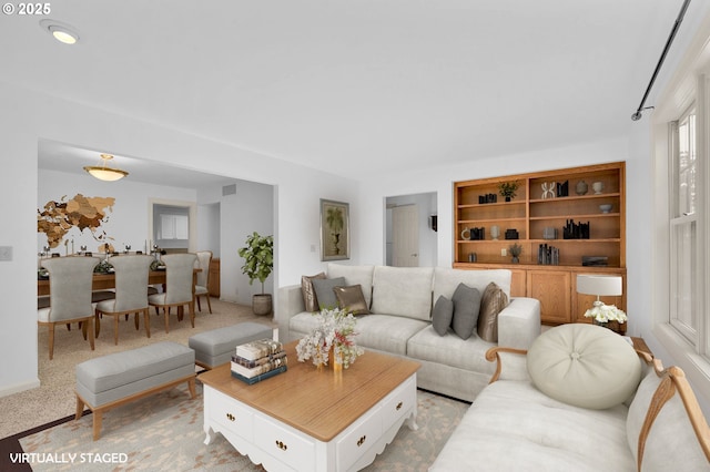 living room with light colored carpet