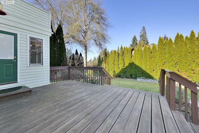 wooden deck with a lawn