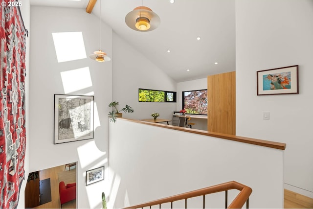2930 NW Quimby St, Portland, OR 97210 - stairs featuring high vaulted ceiling, a skylight, recessed lighting, and wood finished floors