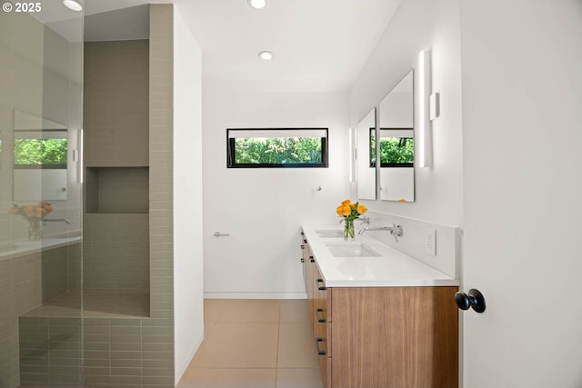 2930 NW Quimby St, Portland, OR 97210 - full bath with double vanity, tile patterned flooring, a tile shower, baseboards, and recessed lighting