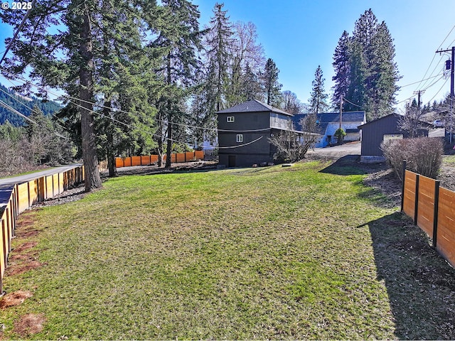 view of yard with a fenced backyard