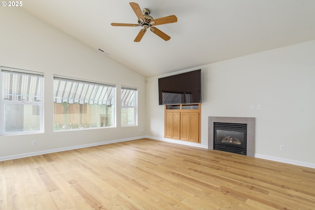 5470 Jeffrey Way, Eugene, OR 97402 - unfurnished living room with light wood-style flooring, ceiling fan, a fireplace, baseboards, and high vaulted ceiling