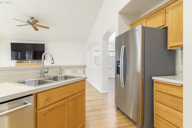 5470 Jeffrey Way, Eugene, OR 97402 - kitchen featuring appliances with stainless steel finishes, a sink, ceiling fan, light wood-style flooring, and light countertops