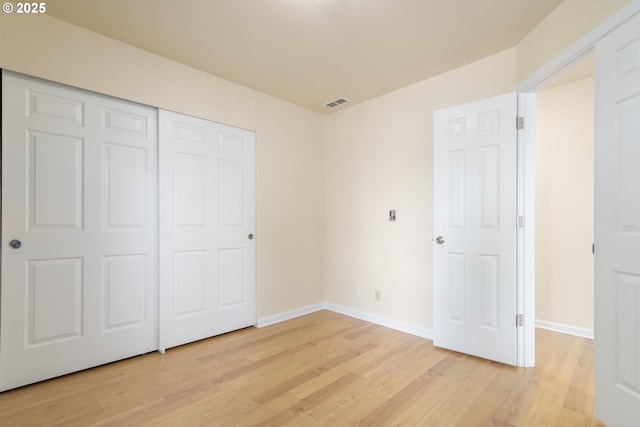 5470 Jeffrey Way, Eugene, OR 97402 - unfurnished bedroom featuring light wood-style flooring, baseboards, and a closet