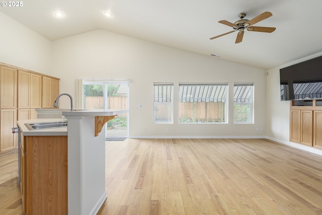 5470 Jeffrey Way, Eugene, OR 97402 - kitchen featuring a sink, plenty of natural light, light wood-type flooring, open floor plan, and high vaulted ceiling