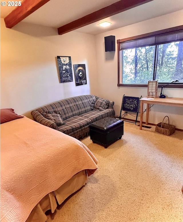 carpeted bedroom featuring beam ceiling