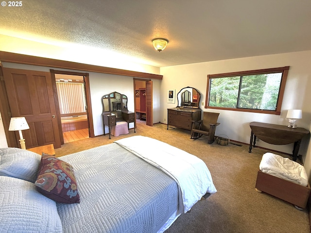 bedroom with ensuite bathroom, light carpet, and a closet