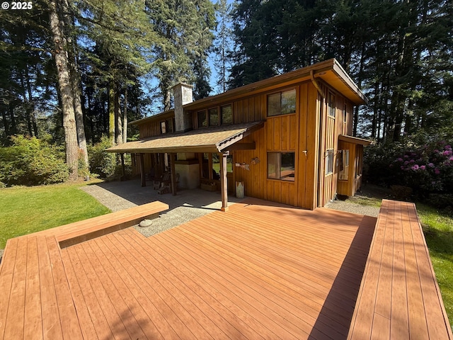 wooden deck with a yard
